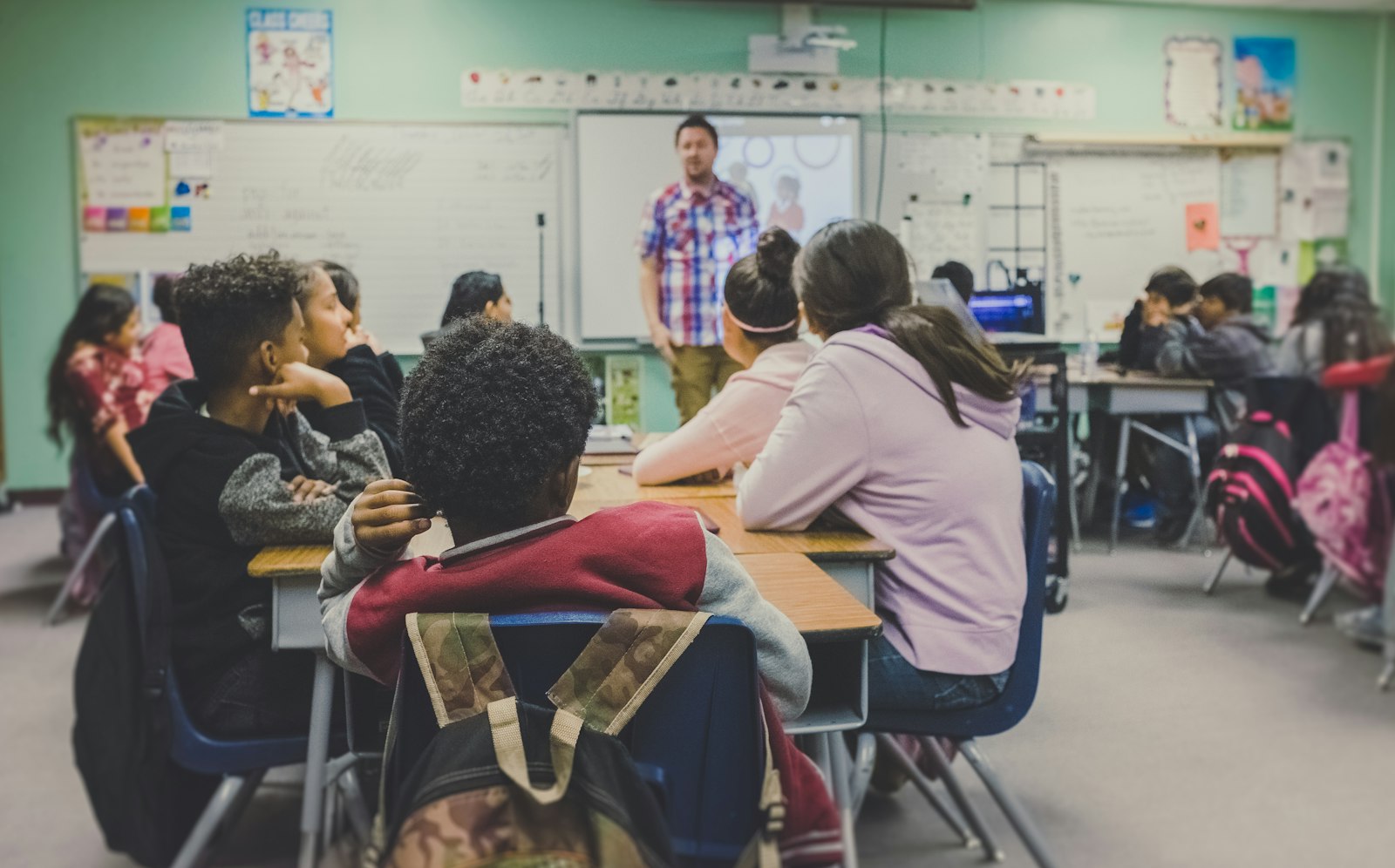 Students in a classroom working during a lesson